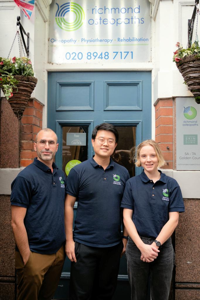 Richmond Osteopaths Team in Clinic Doorway Entrance 2023